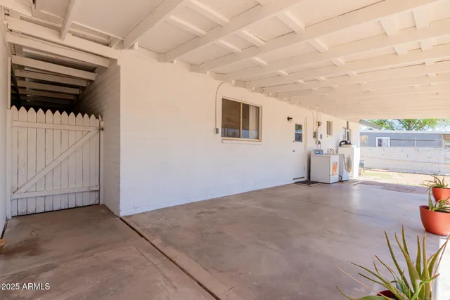 a view of a livingroom with furniture and a garage