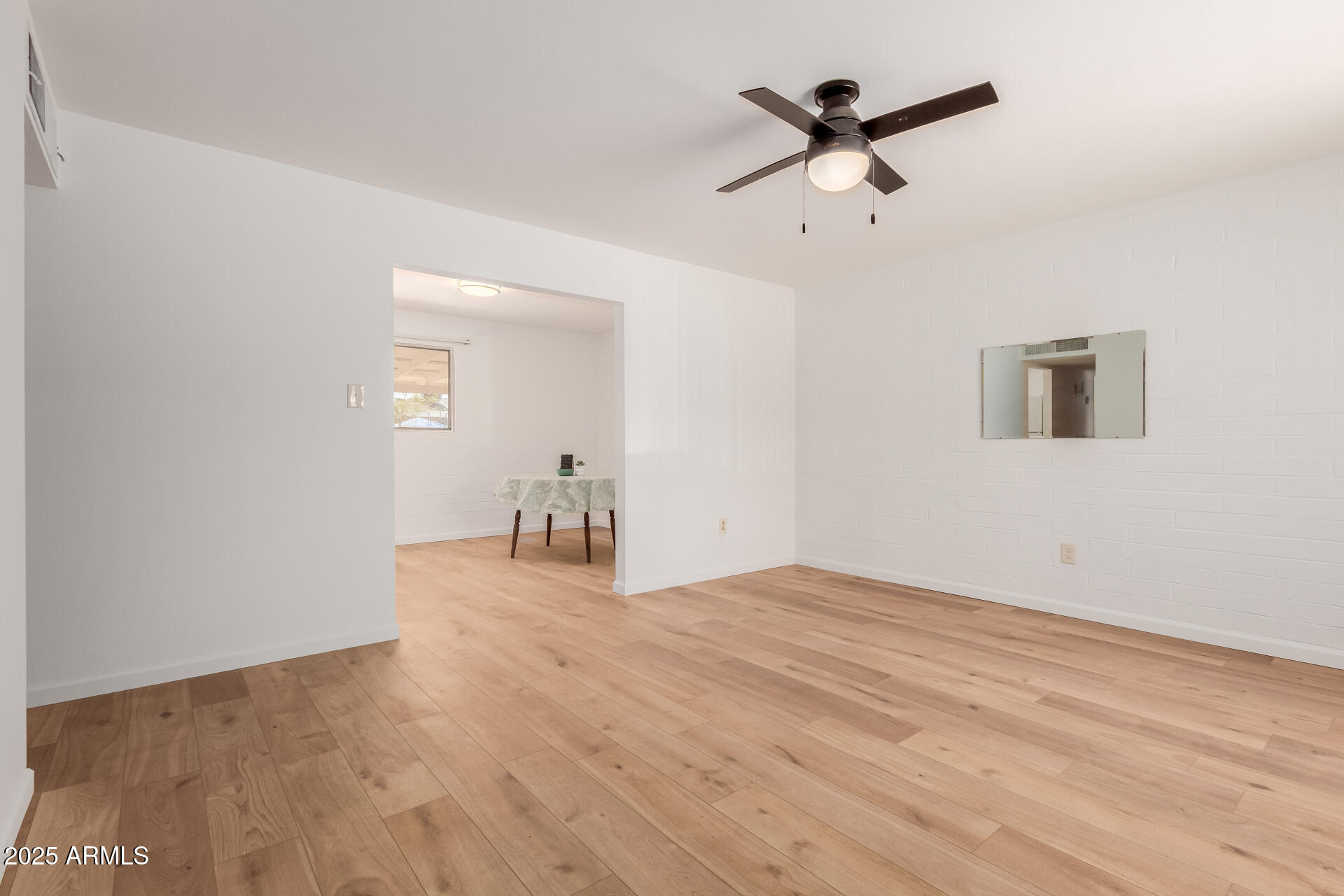 10012 North 16th Drive Phoenix, AZ 85021 - Photo 8 of 39 a view of empty room with wooden floor