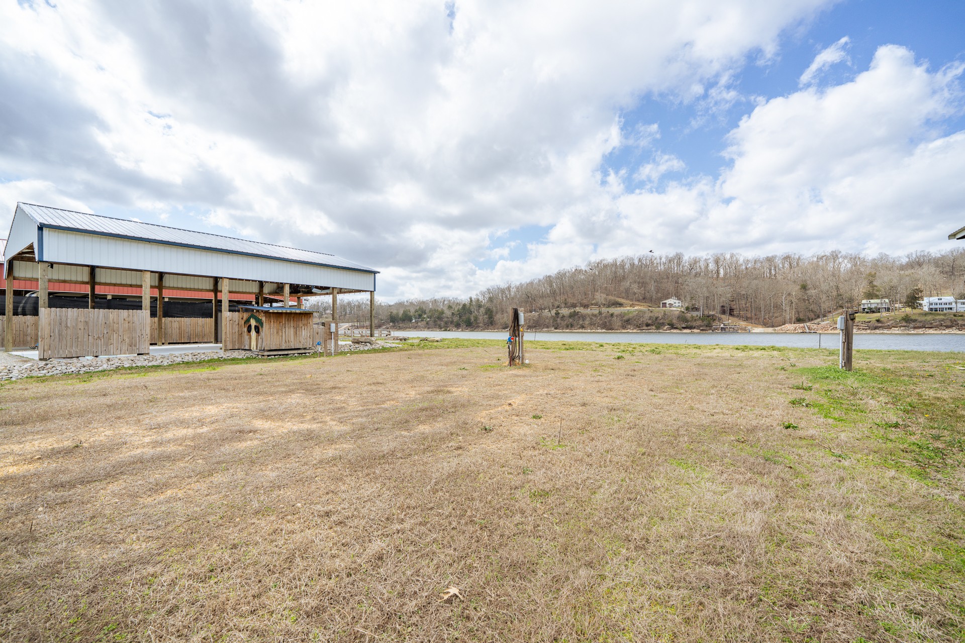 1987 Hardin Bottom River Road Clifton, TN 38425 - Photo 5 of 18 a view of a house with pool and a yard