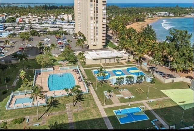 Ocean Drive Ocean Drive, Unit 1408 Luquillo, PR 00773 - Photo 1 of 1 an aerial view of residential houses with outdoor space and swimming pool
