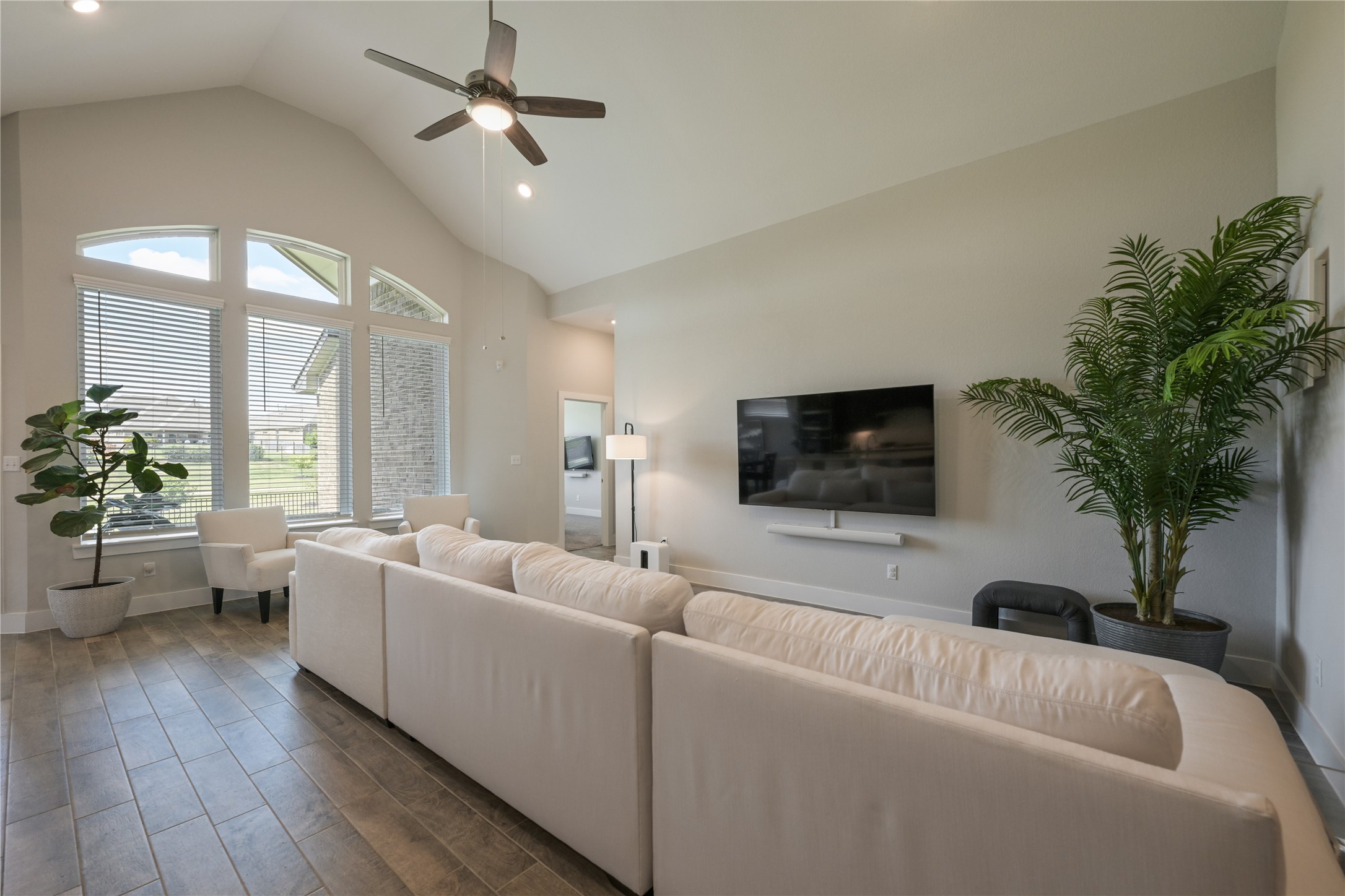 238 Wild Pecan Loop Buda, TX 78610 - Photo 7 of 31 High vaulted ceilings and tile flooring enhance this open, light-filled living space.