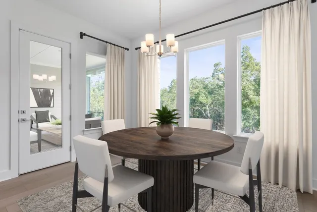 a view of a dining room with furniture window and outside view