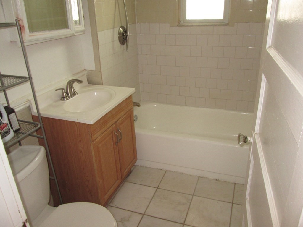 7-9 Reed Street Cambridge, MA 02140 - Photo 12 of 41 a bathroom with a sink a toilet and shower
