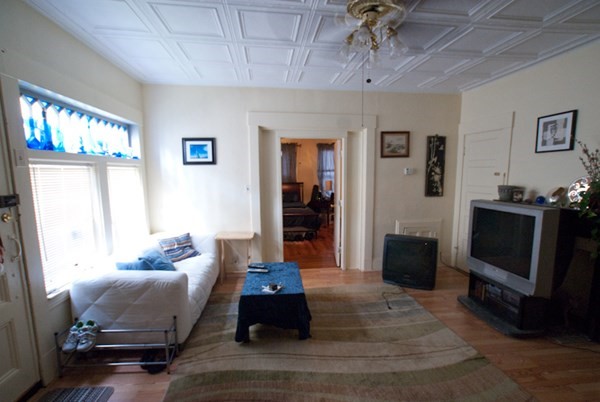 7-9 Reed Street Cambridge, MA 02140 - Photo 29 of 41 a living room with furniture and a flat screen tv