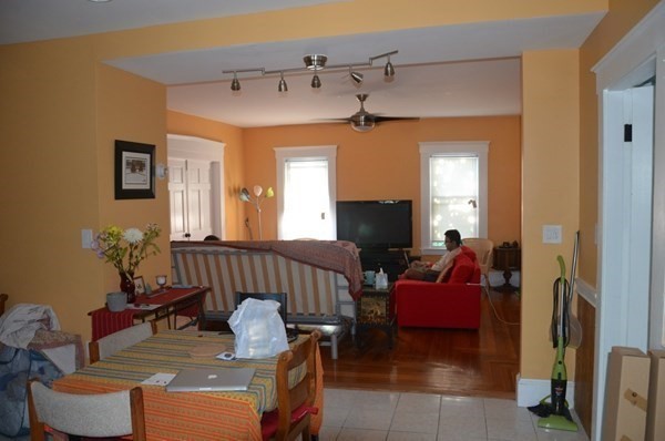 7-9 Reed Street Cambridge, MA 02140 - Photo 3 of 41 a living room with furniture and a flat screen tv