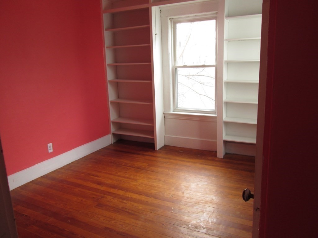 7-9 Reed Street Cambridge, MA 02140 - Photo 10 of 41 a view of empty room with wooden floor and fan