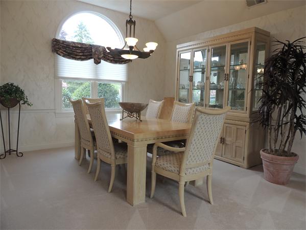 5 Chapelgate Road Canton, MA 02021 - Photo 3 of 20 a view of a dining room with furniture and chandelier