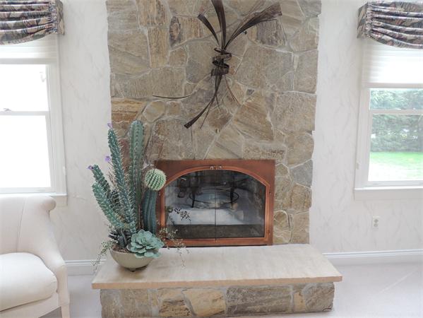 5 Chapelgate Road Canton, MA 02021 - Photo 5 of 20 a living room with furniture and a fireplace