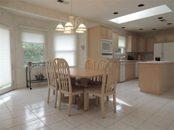 5 Chapelgate Road Canton, MA 02021 - Photo 7 of 20 a view of a dining room with furniture and a chandelier