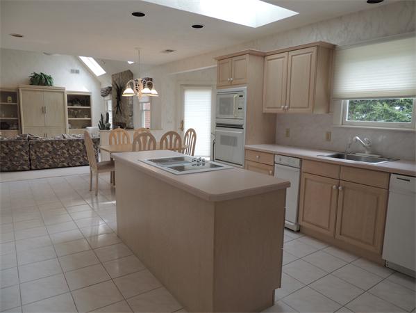 5 Chapelgate Road Canton, MA 02021 - Photo 8 of 20 a kitchen with a sink window and cabinets