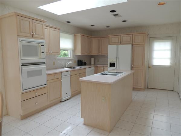 5 Chapelgate Road Canton, MA 02021 - Photo 9 of 20 a kitchen with a sink cabinets and window