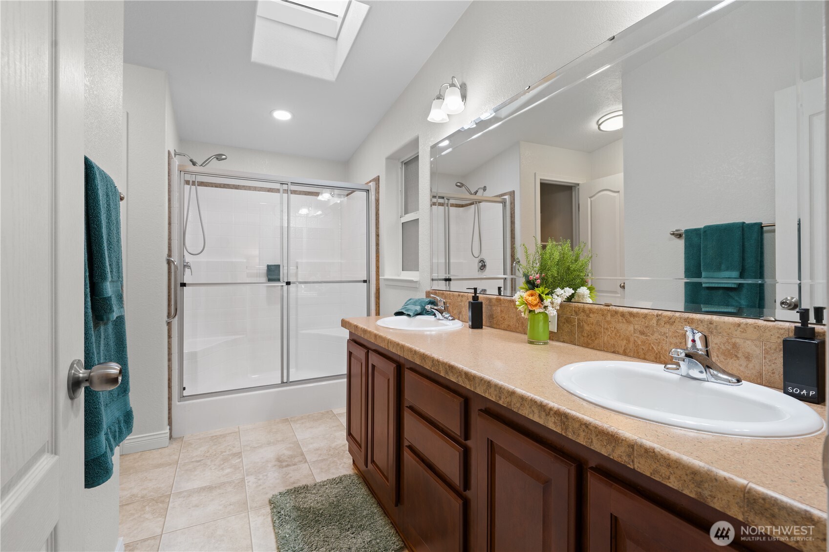 23825 15th Avenue Southeast, Unit 427 Bothell, WA 98021 - Photo 13 of 38 a bathroom with a sink double vanity and a mirror