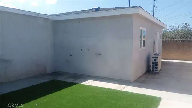 a kitchen with a refrigerator and window