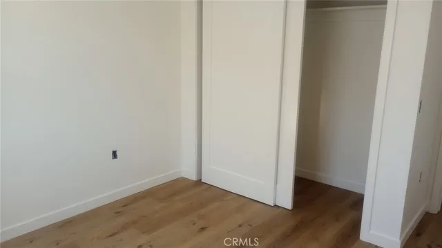 a view of a small space with wooden floor