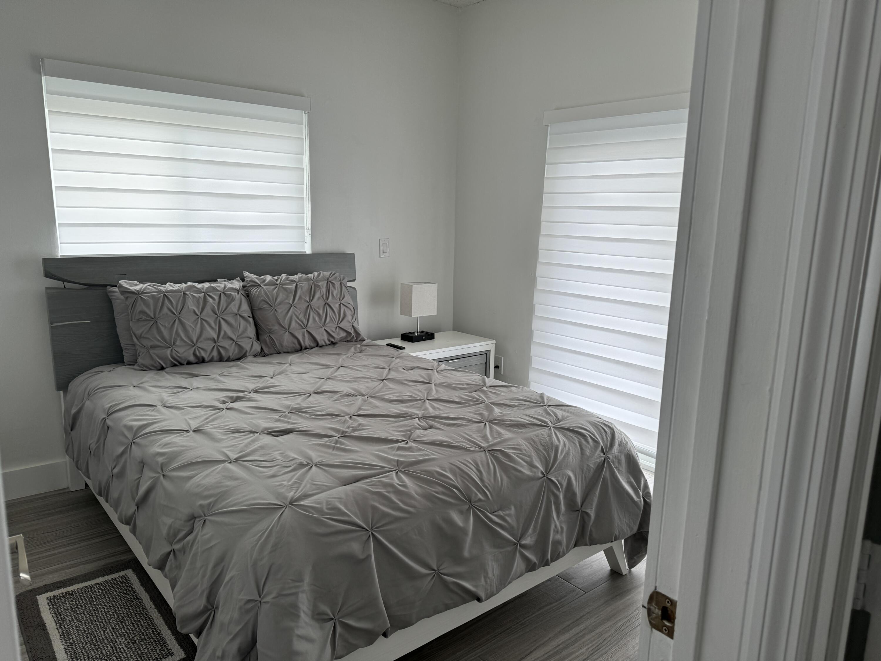 176 Lorelane Place Key Largo, FL 33037 - Photo 12 of 20 a bedroom with a bed and window