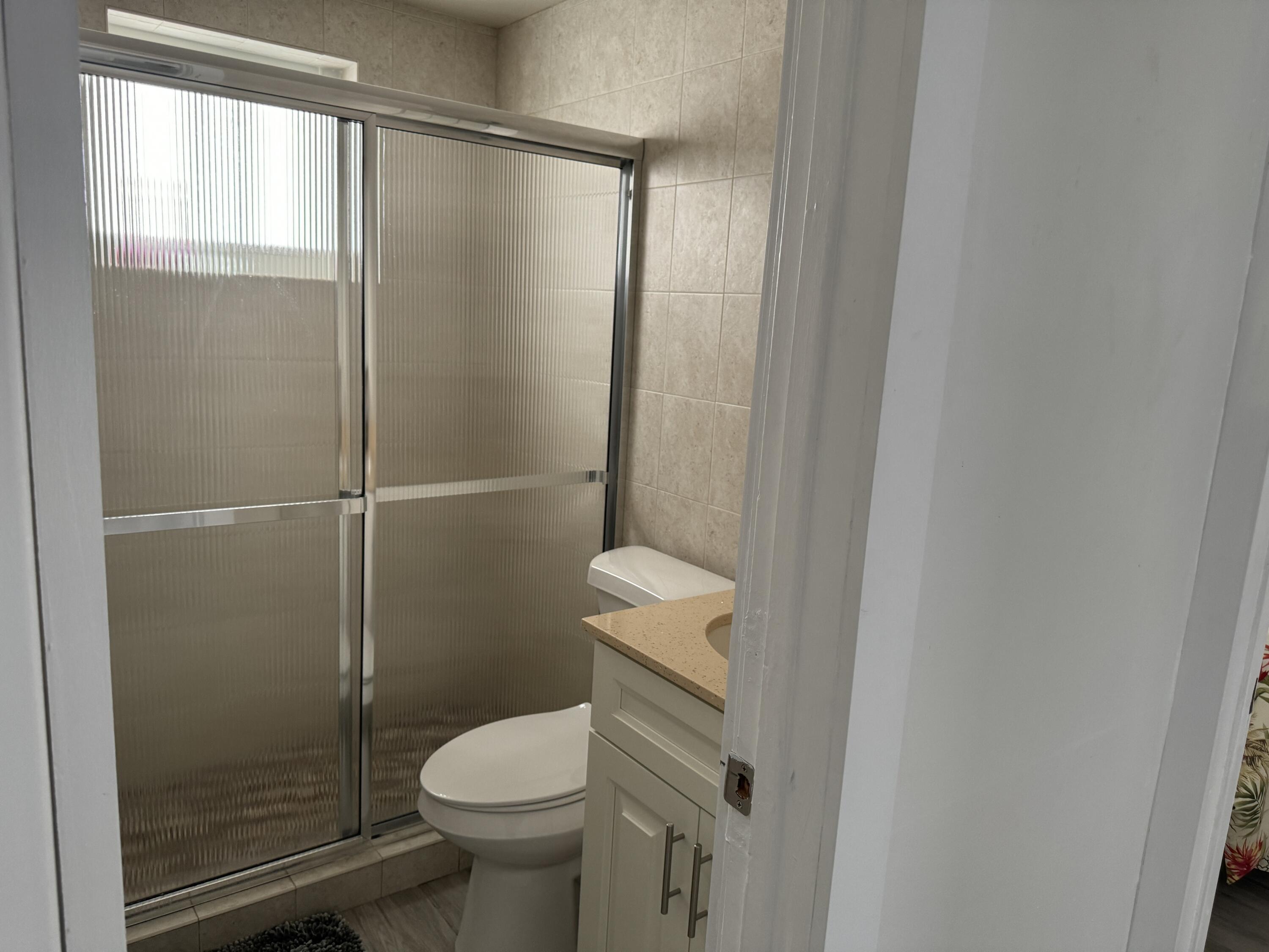 176 Lorelane Place Key Largo, FL 33037 - Photo 14 of 20 a bathroom with a toilet and a shower