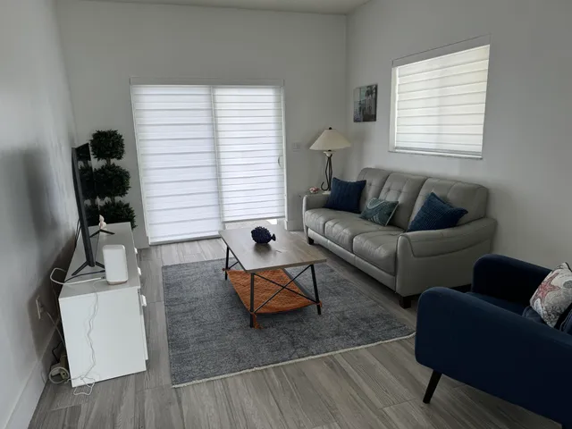 a living room with furniture and a window