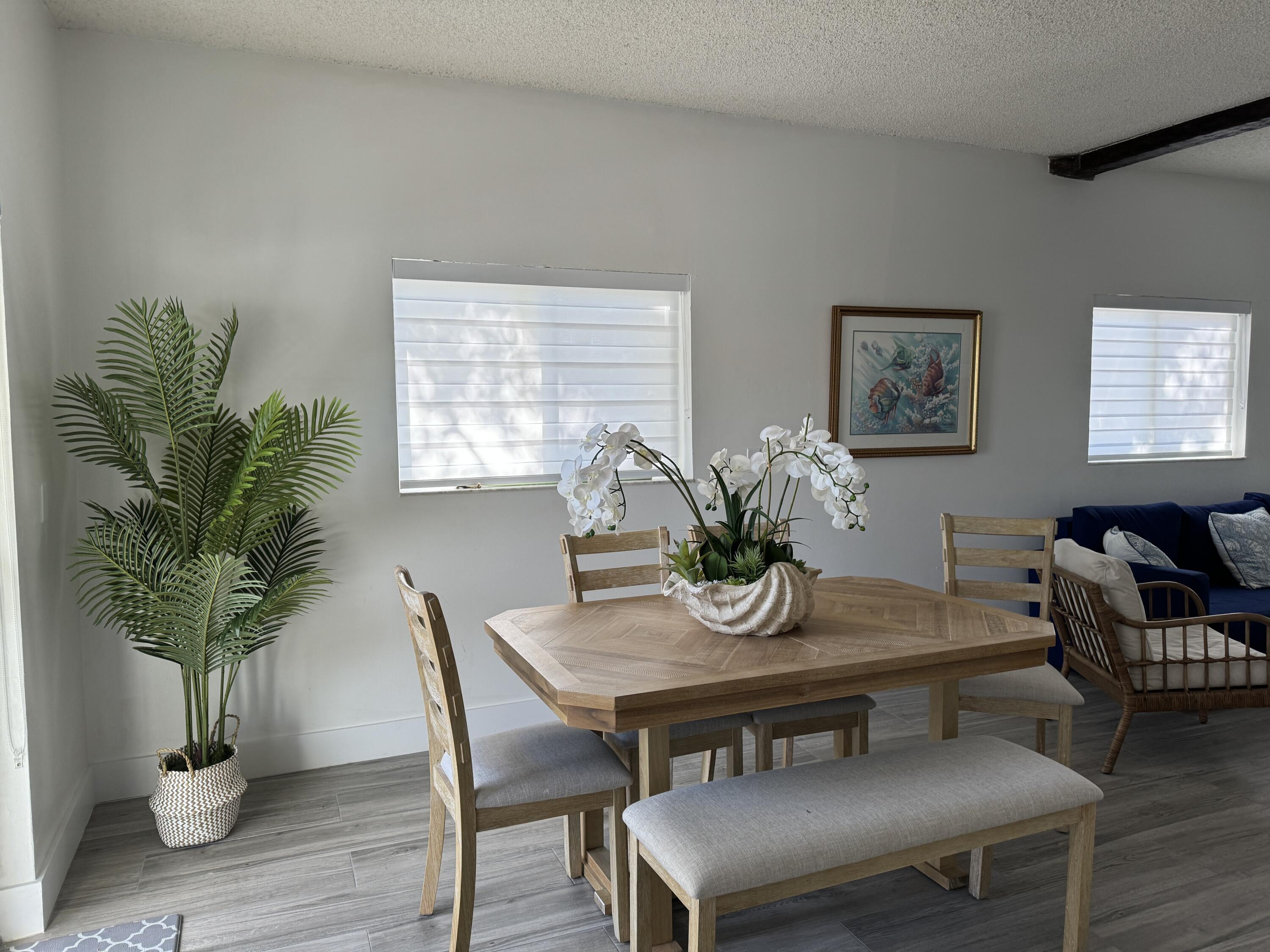 176 Lorelane Place Key Largo, FL 33037 - Photo 17 of 20 a view of a dining room with furniture window and wooden floor