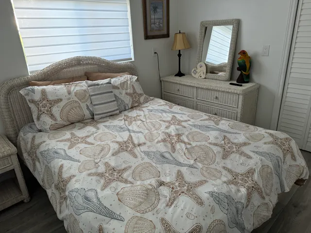a bathroom with a granite countertop toilet and a shower