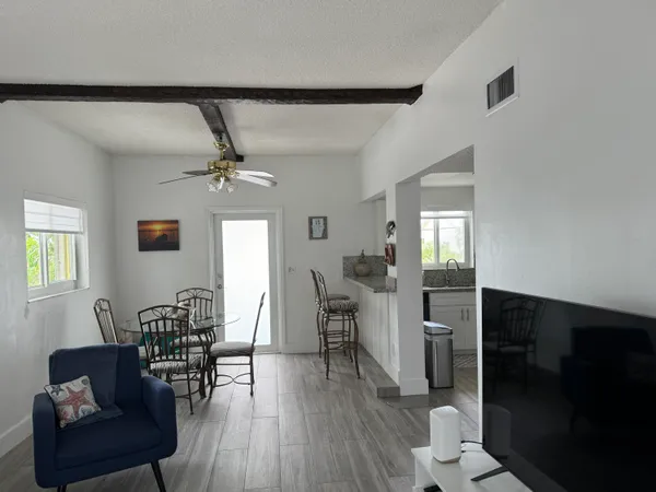 a view of a livingroom with furniture and wooden floor