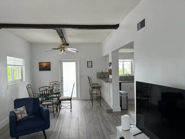 a view of a livingroom with furniture and wooden floor