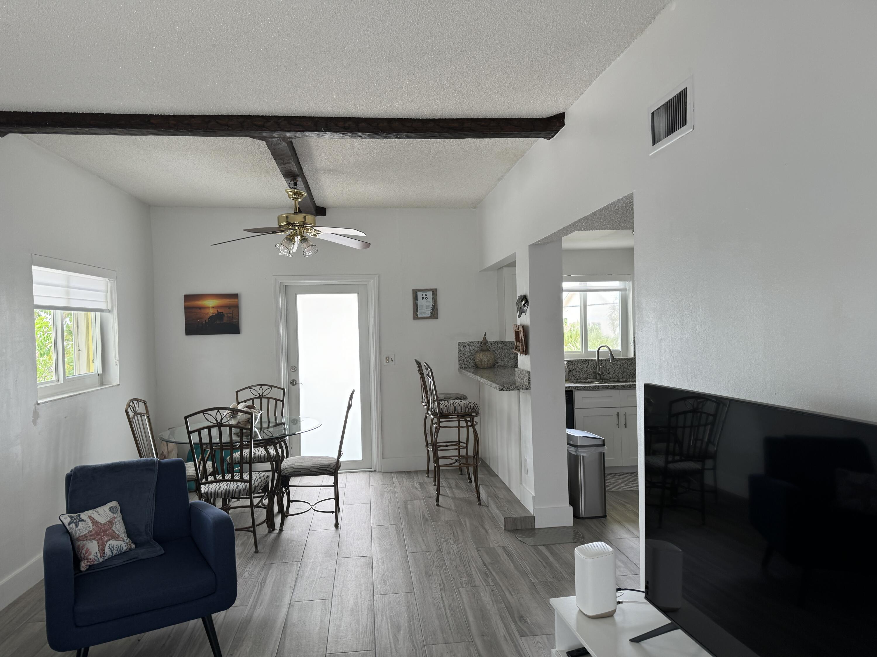 176 Lorelane Place Key Largo, FL 33037 - Photo 7 of 20 a living room with furniture and wooden floor