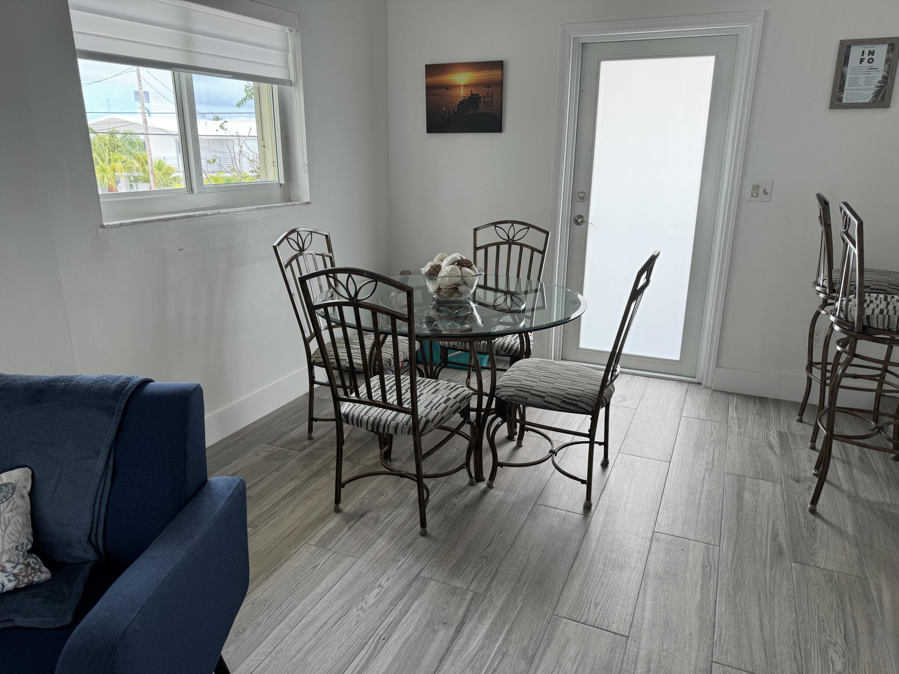 176 Lorelane Place Key Largo, FL 33037 - Photo 8 of 20 a view of a livingroom with furniture and wooden floor