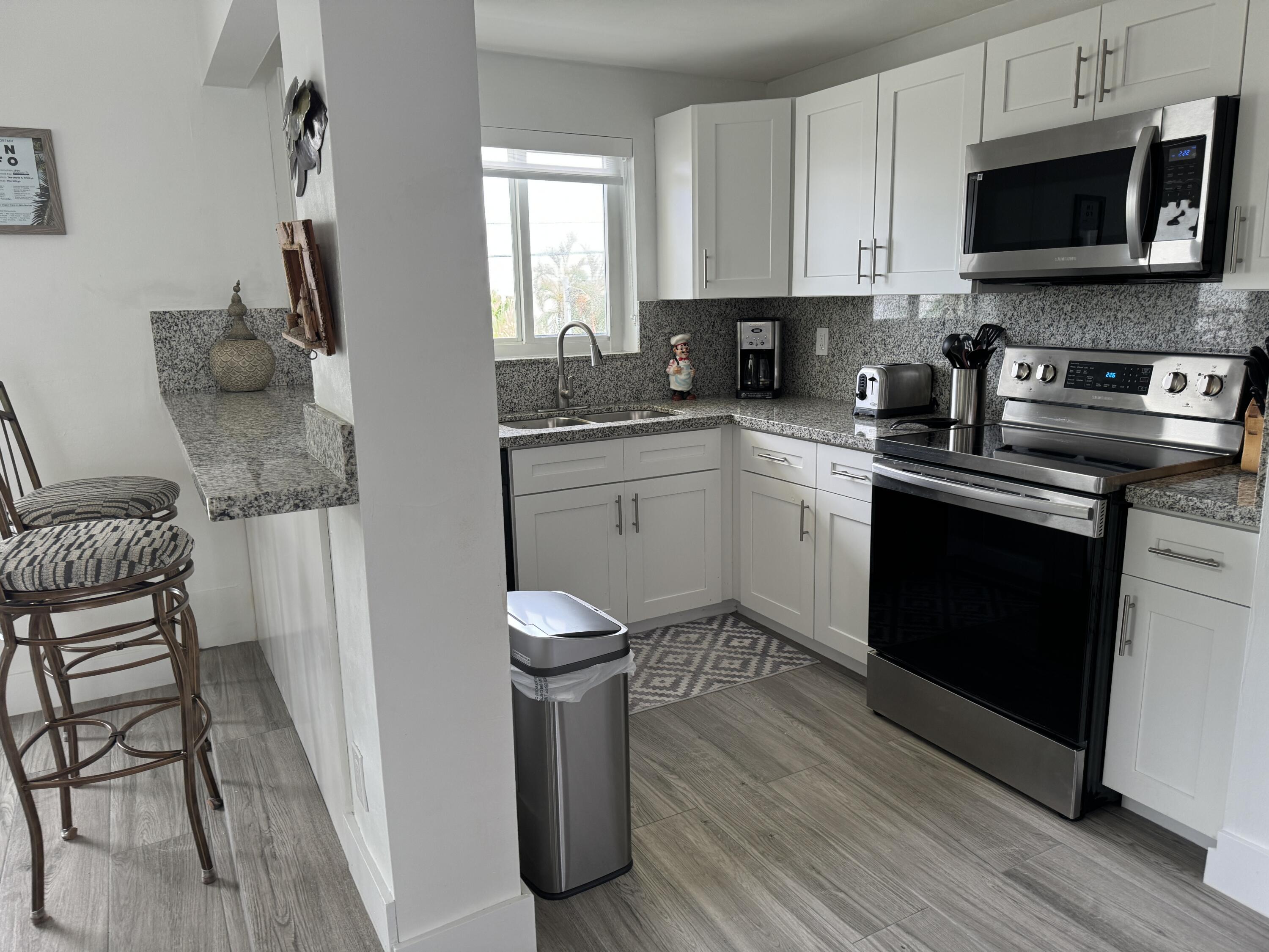 176 Lorelane Place Key Largo, FL 33037 - Photo 9 of 20 a kitchen with a sink cabinets and appliances