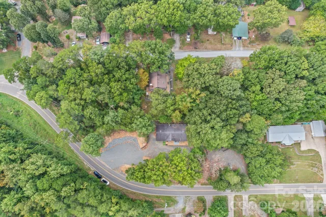 an aerial view of a house with outdoor space and street view