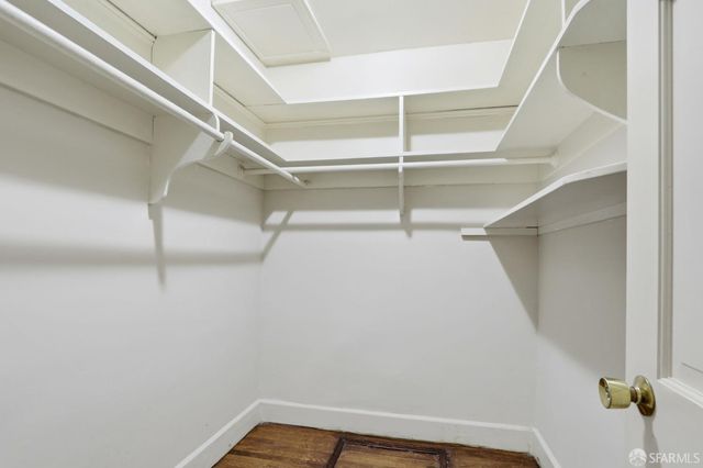 a spacious bedroom with a bed and a couch