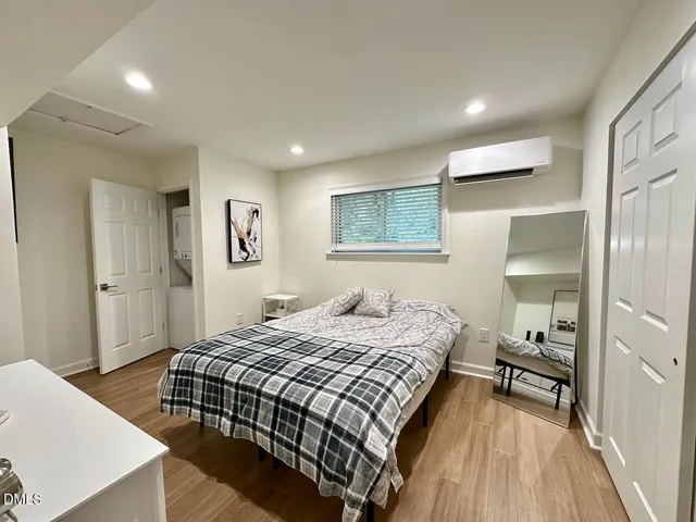 a bedroom with a bed and a dresser