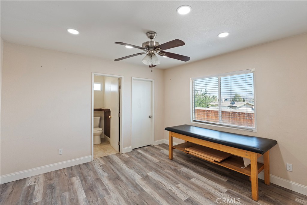 23859 S Road Apple Valley, CA 92307 - Photo 13 of 45 a empty room with a window and a ceiling fan
