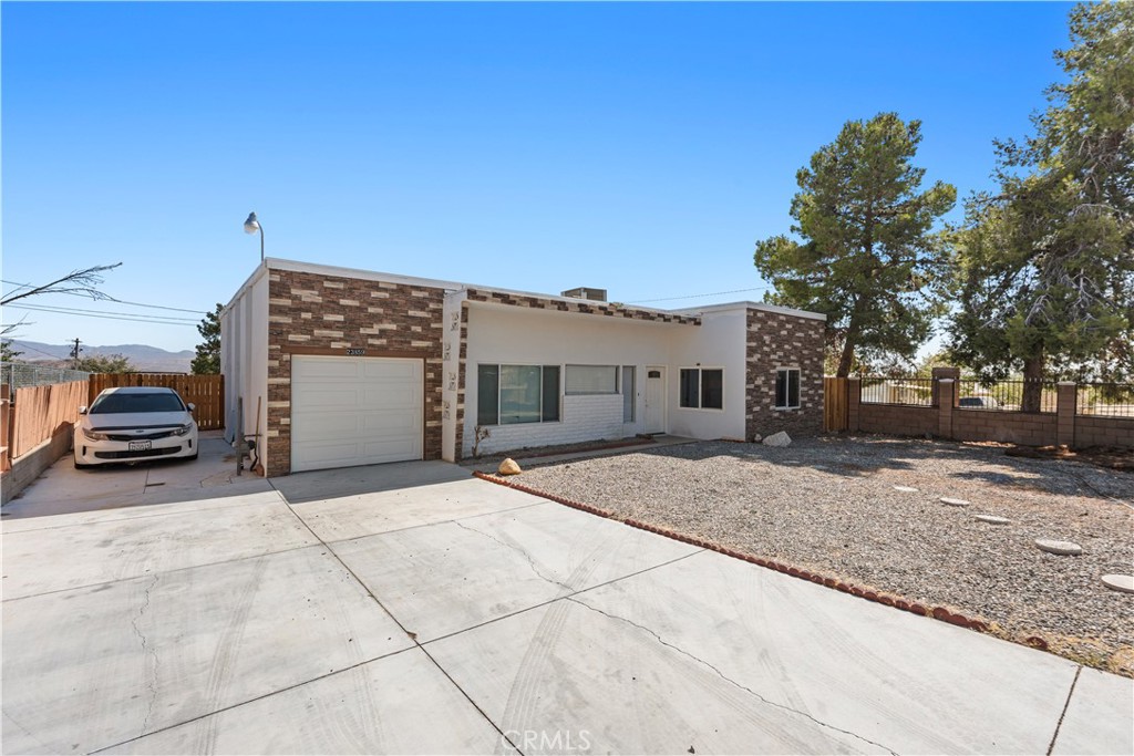 23859 S Road Apple Valley, CA 92307 - Photo 2 of 45 a view of a car park in front of house