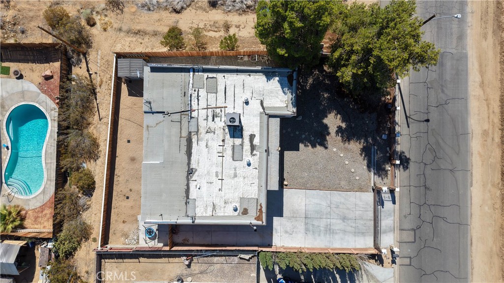 23859 S Road Apple Valley, CA 92307 - Photo 26 of 45 a view of a house with a tree and windows