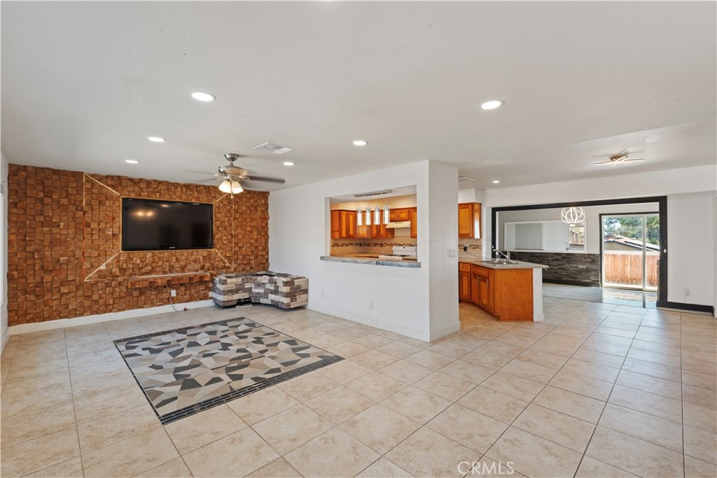 23859 S Road Apple Valley, CA 92307 - Photo 4 of 45 a kitchen with stainless steel appliances kitchen island granite countertop a refrigerator and a stove top oven
