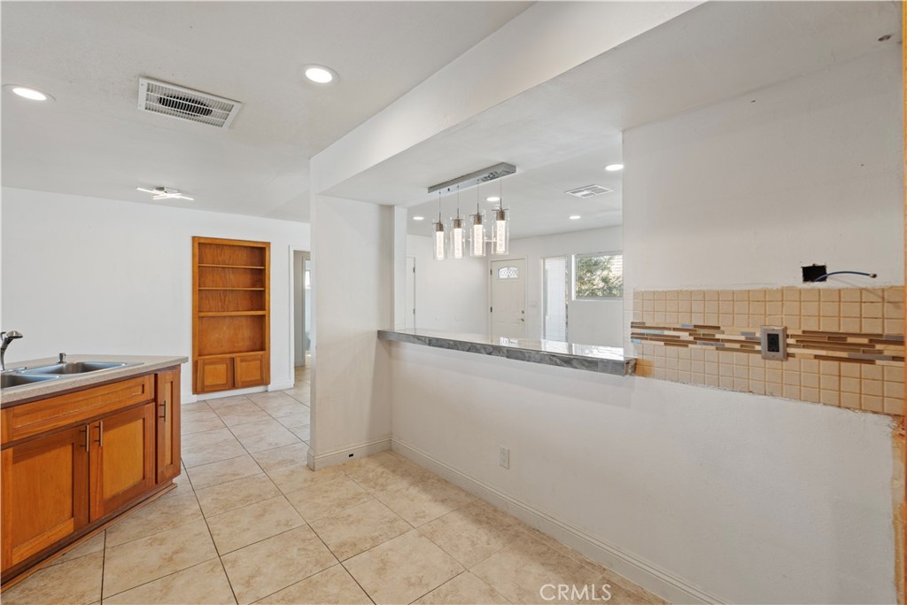 23859 S Road Apple Valley, CA 92307 - Photo 10 of 45 a kitchen with stainless steel appliances granite countertop a sink and cabinets