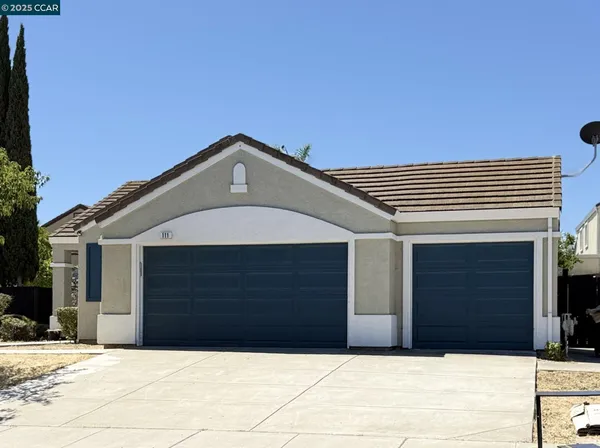 a front view of a house with garage