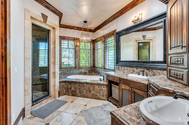 811 South High Ridge Drive Alpine, UT 84004 - Photo 27 of 98 Full bathroom featuring vanity, a garden tub, a shower stall, crown molding, and light tile patterned floors