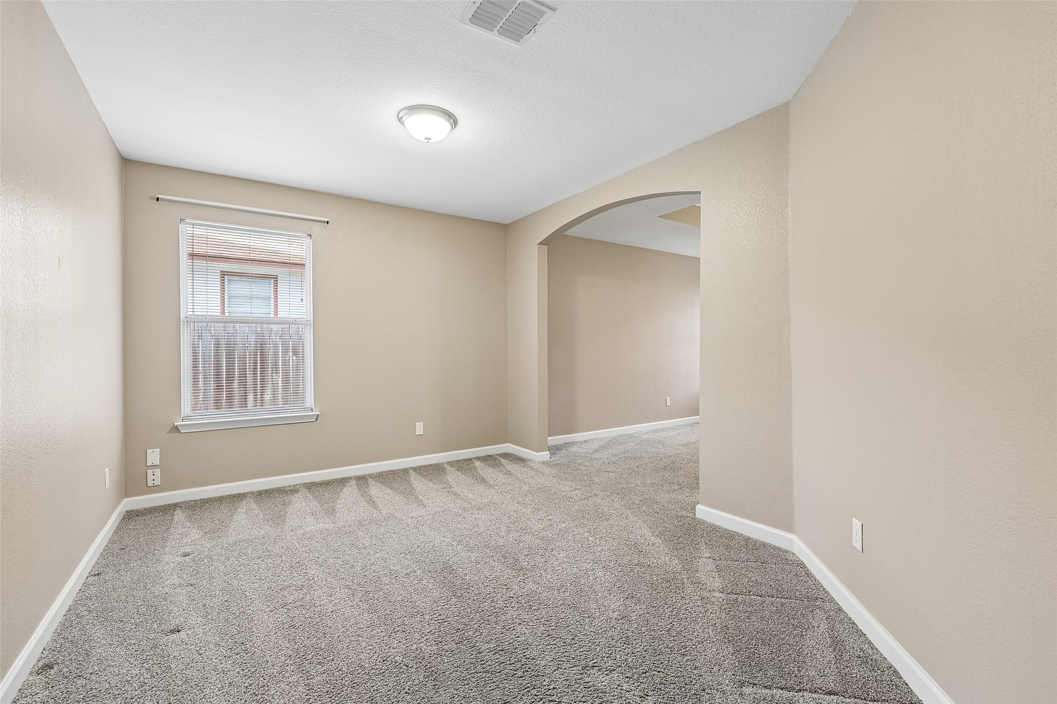 152 Grant Way Kyle, TX 78640 - Photo 24 of 39 a view of an empty room with a window