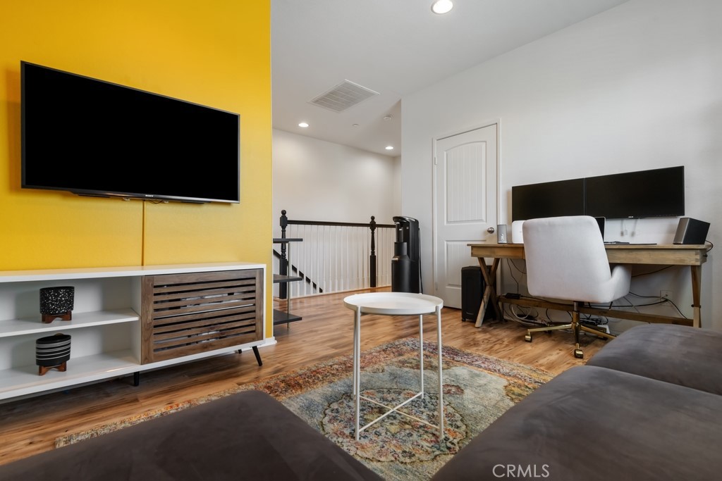29463 Bouris Drive Menifee, CA 92584 - Photo 15 of 26 a workspace with furniture and flat screen tv