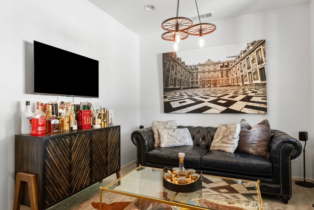 29463 Bouris Drive Menifee, CA 92584 - Photo 2 of 26 a living room with furniture and a flat screen tv