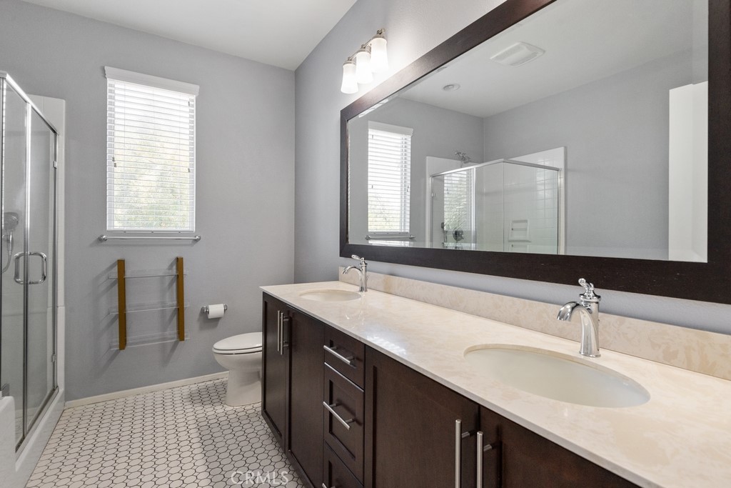 29463 Bouris Drive Menifee, CA 92584 - Photo 9 of 26 a bathroom with a sink double vanity granite and a mirror
