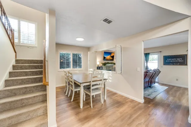 a view of a livingroom with furniture and wooden floor
