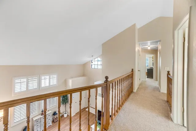 a bedroom with a bed dresser and a window