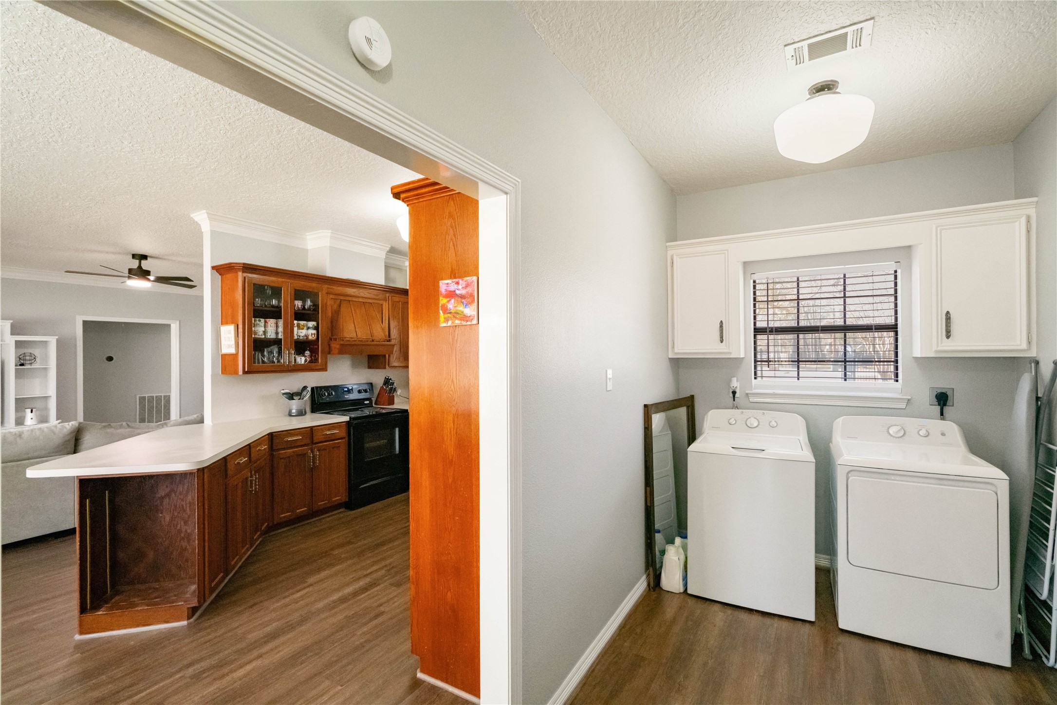 28911 Commons Oaks Drive Huffman, TX 77336 - Photo 17 of 26 a view of a kitchen with washer and dryer