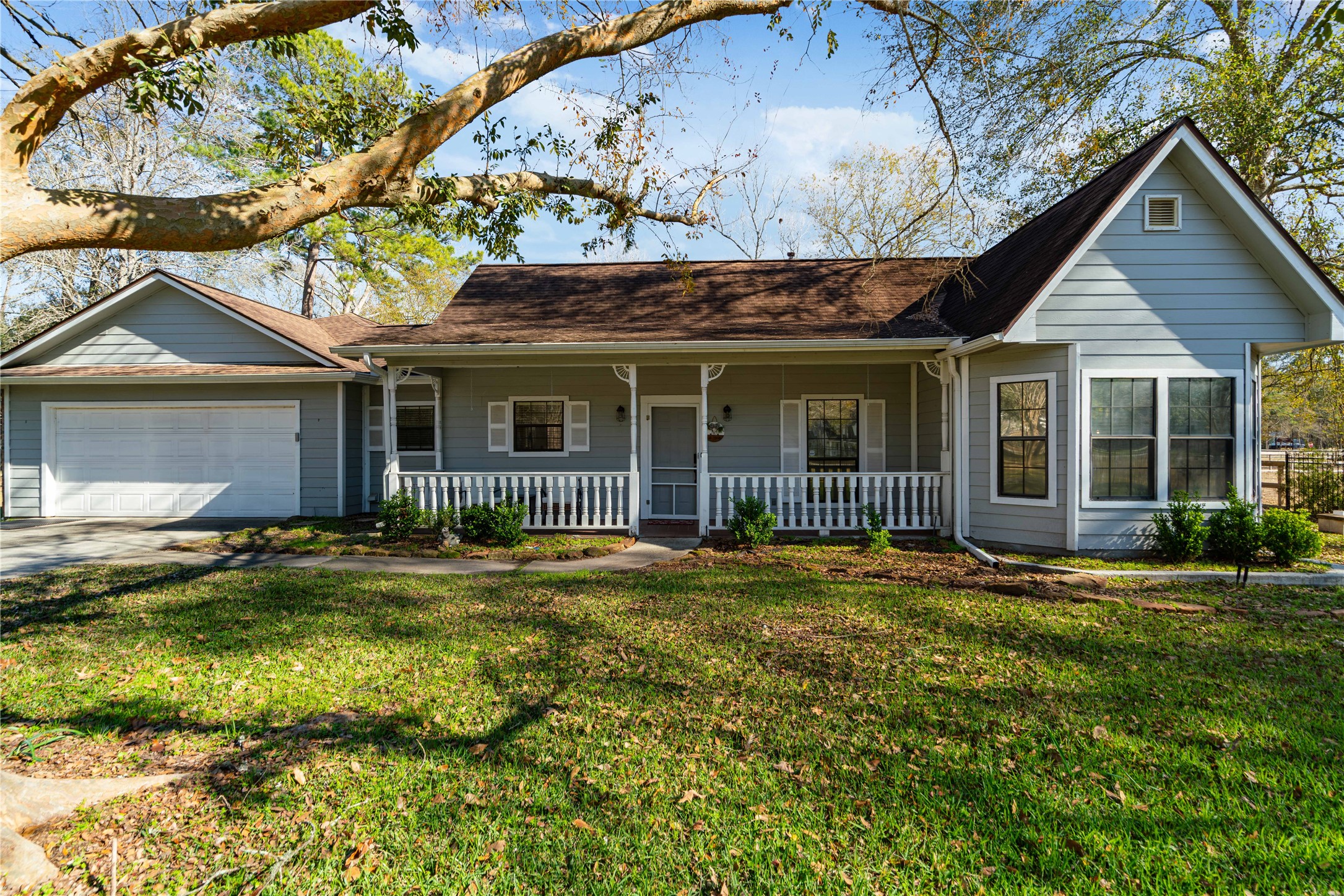 28911 Commons Oaks Drive Huffman, TX 77336 - Photo 2 of 26 a front view of a house with a yard