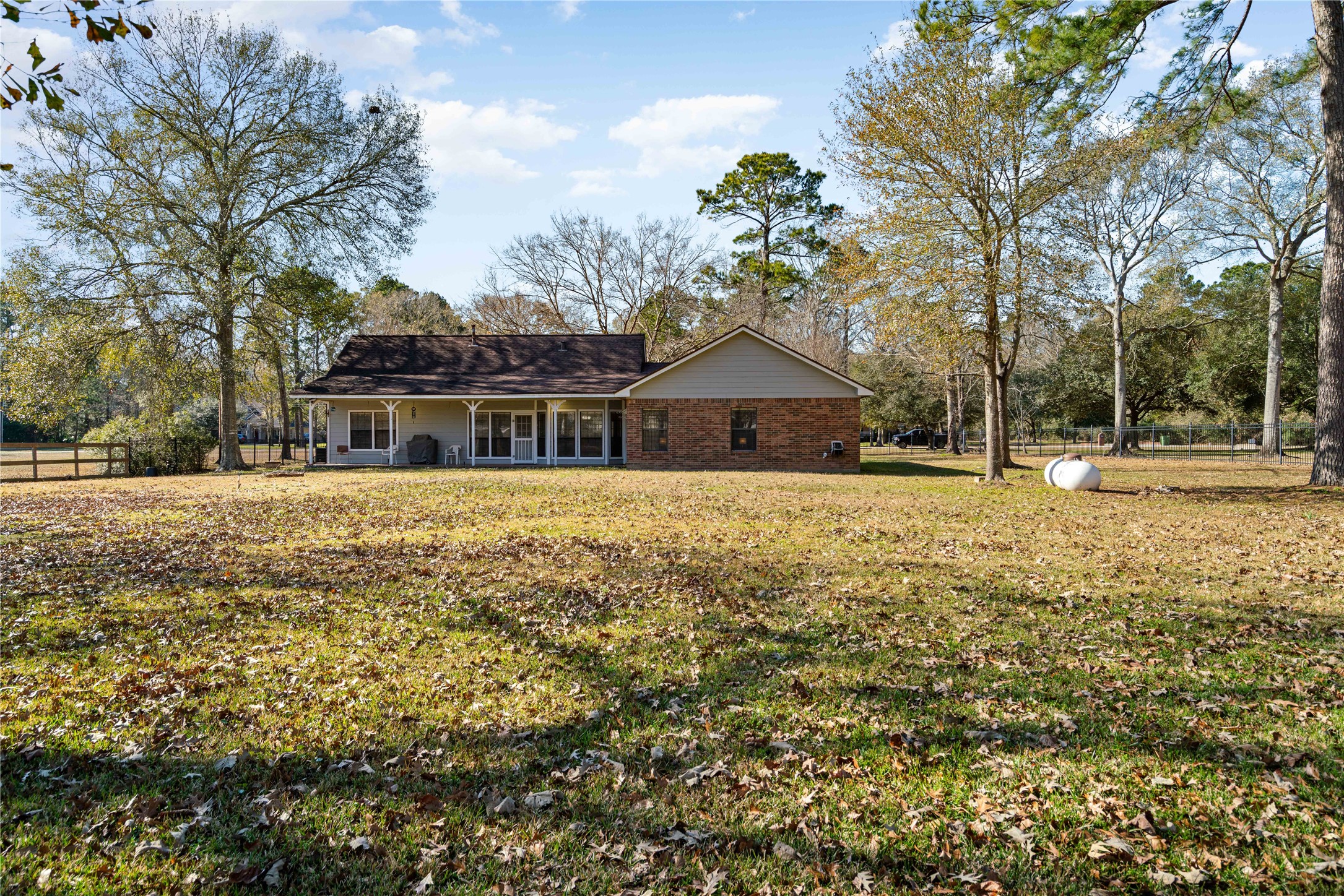 28911 Commons Oaks Drive Huffman, TX 77336 - Photo 22 of 26 a front view of a house with a yard