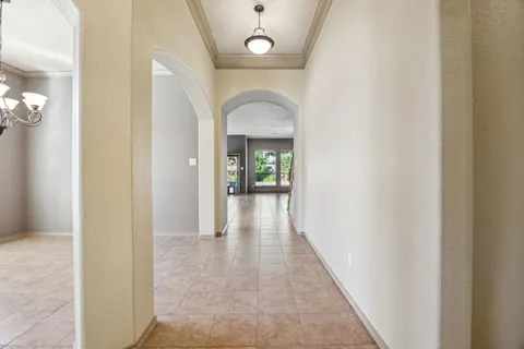 a view of a hallway view with wooden floor and staircase