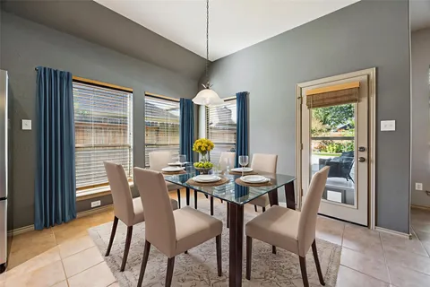 a view of a dining room with furniture and window