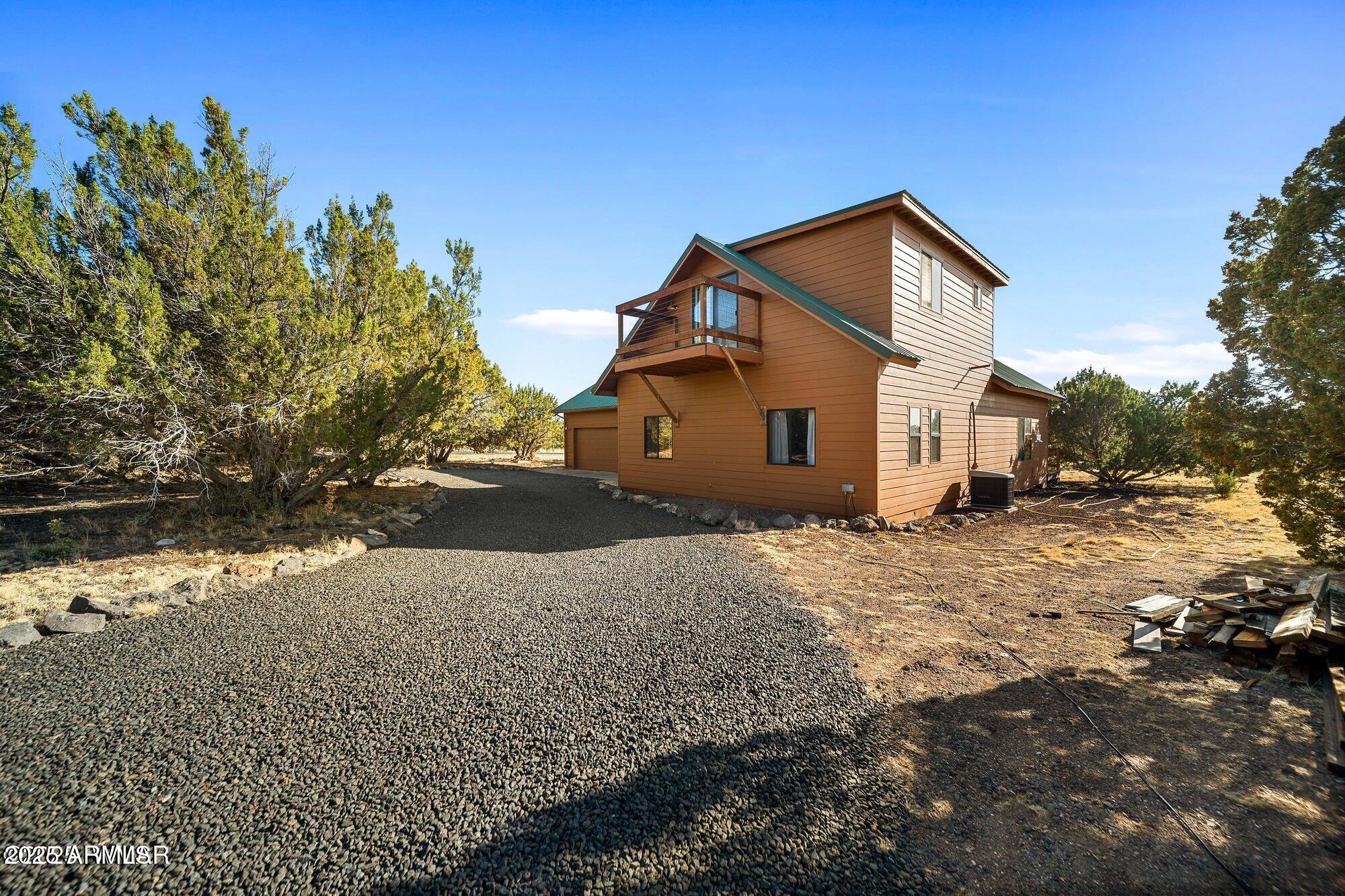 1923 Creekside Circle Show Low, AZ 85901 - Photo 22 of 71 a view of a house with a yard